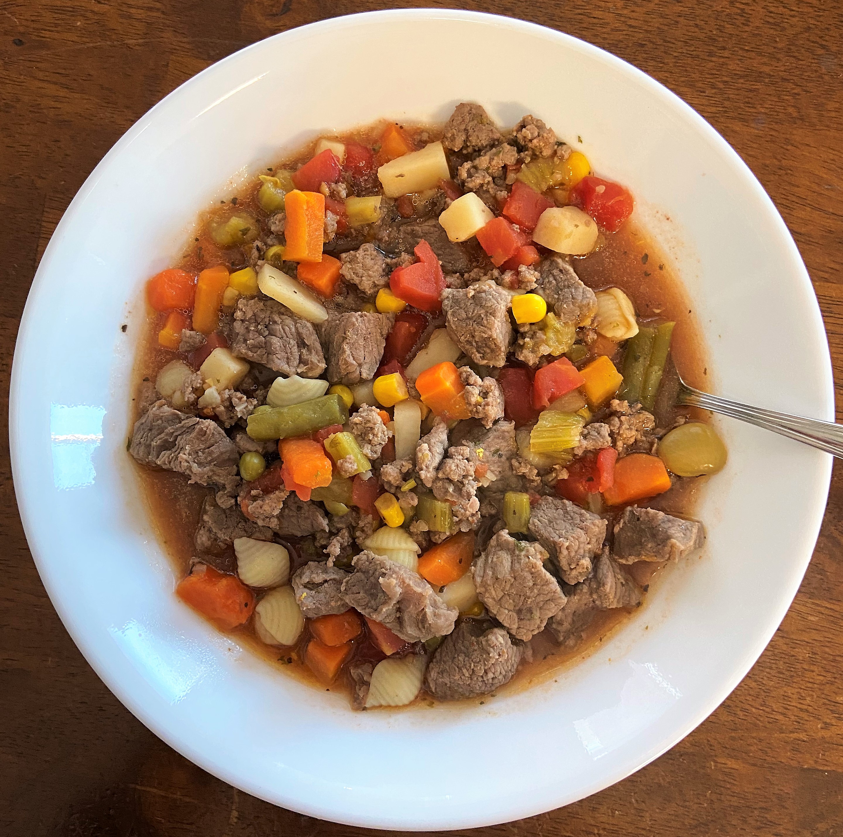 once your vegetable beef soup is cooked, pour some into a bowl and enjoy
