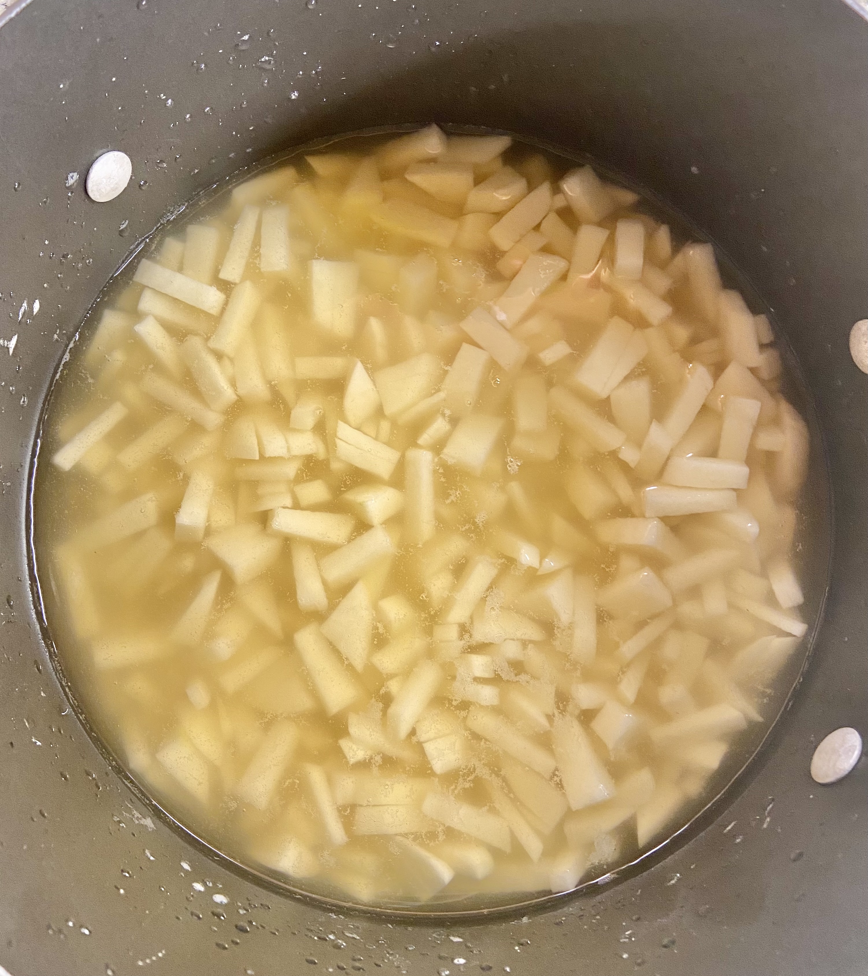 add enough potatoes to fill right below the chicken broth line