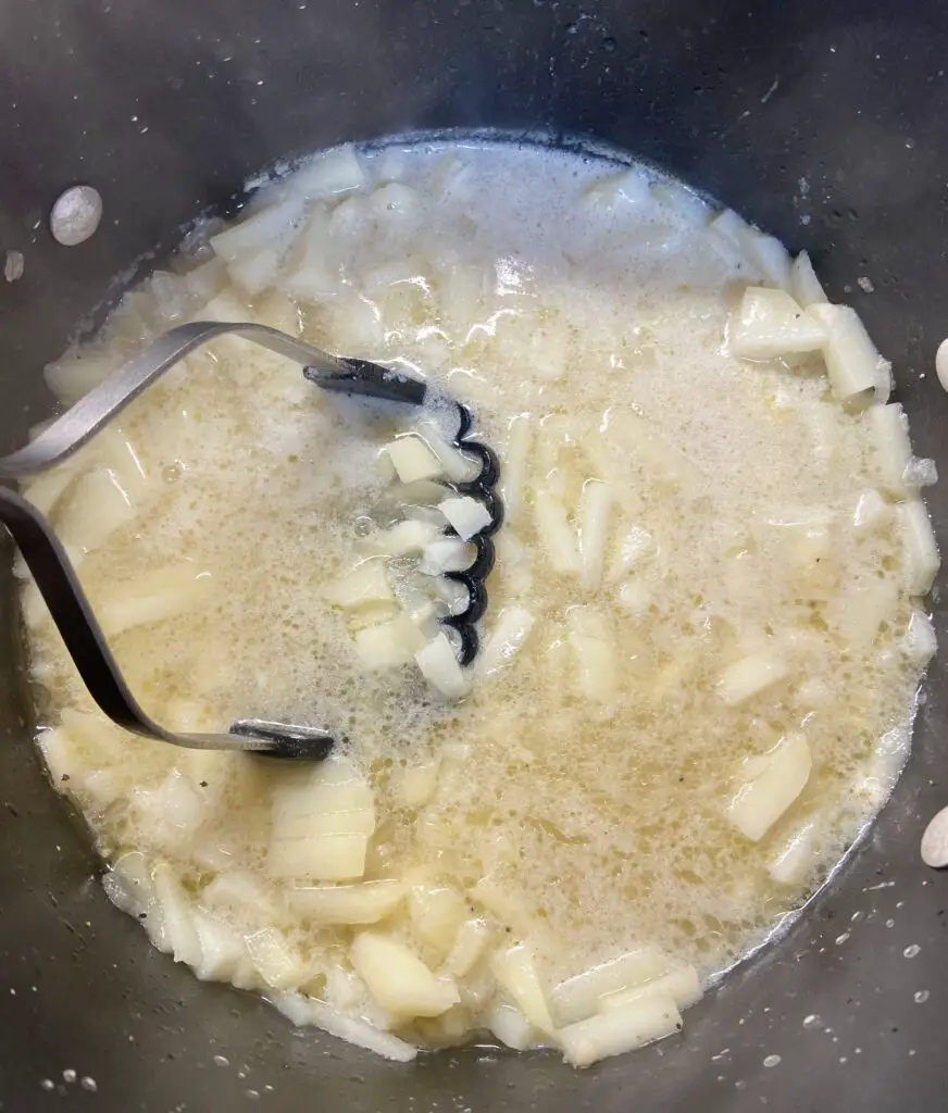 smash potato soup with a potato smashers to break up some of the big pieces